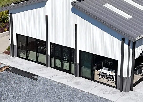 Commercial steel building with glazed sliding doors